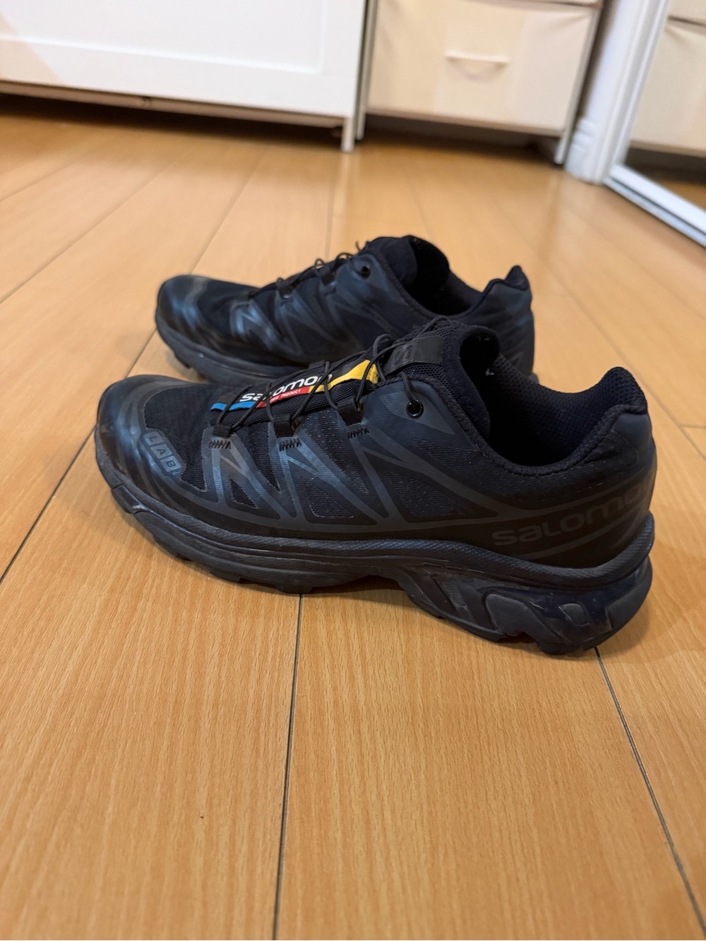 Salomon Black Athletic Trail Shoes with Subtle Yellow Accent